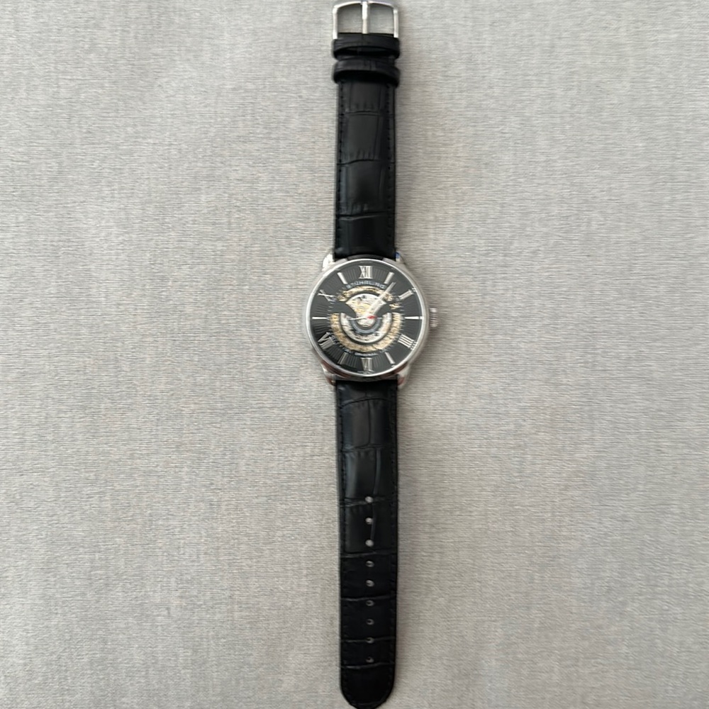 Stuhrling Watch. Black leather band with automatic face.
